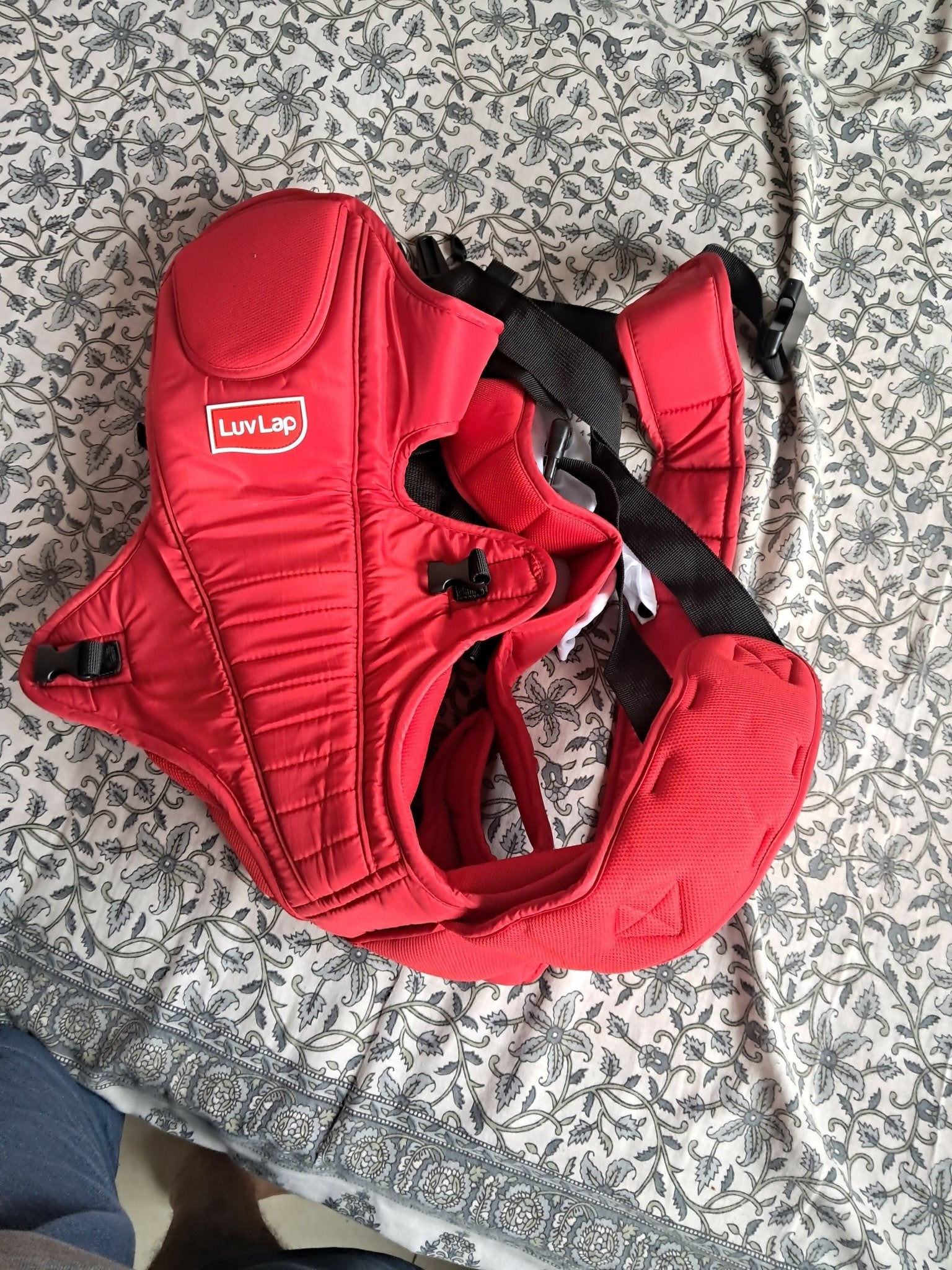 LuvLap Galaxy baby carrier in red with ergonomic support, adjustable straps, cushioned comfort, secure carrying design, and hands-free convenience for babies and parents.