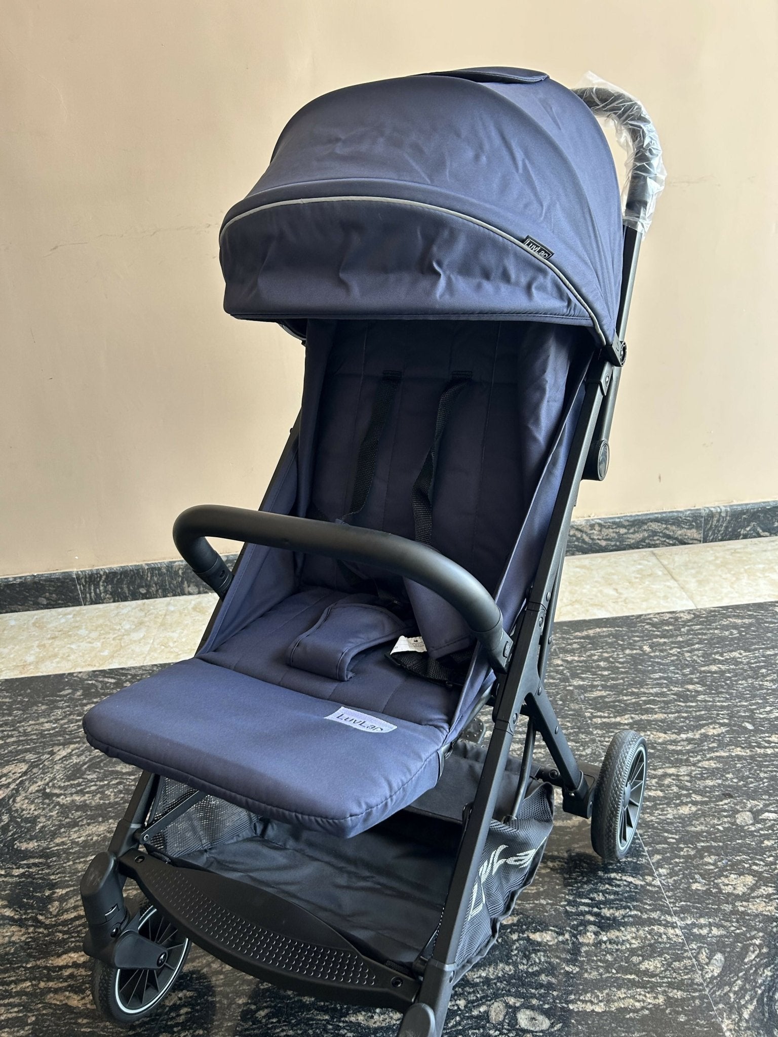 LuvLap Royal stroller with reclining seat, foldable design, safety harness, adjustable canopy, smooth wheels, and comfortable travel support for babies and toddlers.