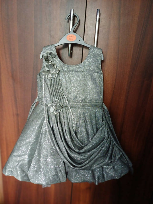 Elevate your baby girl's look with our Silver Frock/Dress, offering timeless charm and elegance for special occasions.