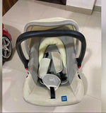 MEE MEE 4-in-1 Multi-Purpose Baby Carry Cot/Car Seat with Rocking Chair featuring padded seating, safety harness, ergonomic carry handle, protective canopy, and versatile design for travel, carrying, rocking, and seating.