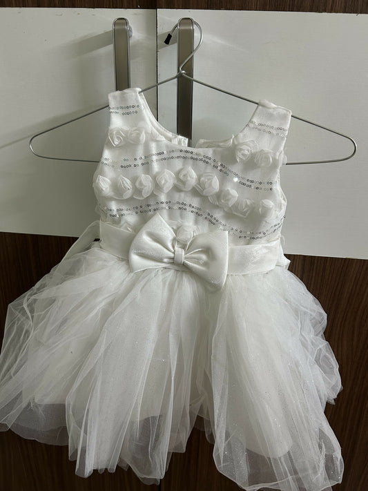 White dress with decorative elements