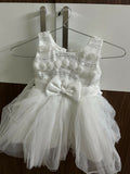 White dress with decorative elements