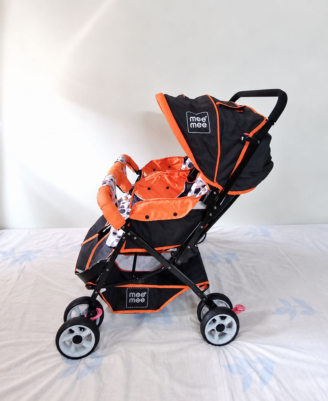 MEE MEE Twin Baby Stroller/Double Pram in Orange, Some Used condition, featuring two seats, reclining design, protective canopies and a foldable frame for convenient outings with twins or two young children.