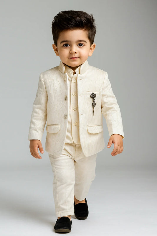 Young boy wearing a white suit