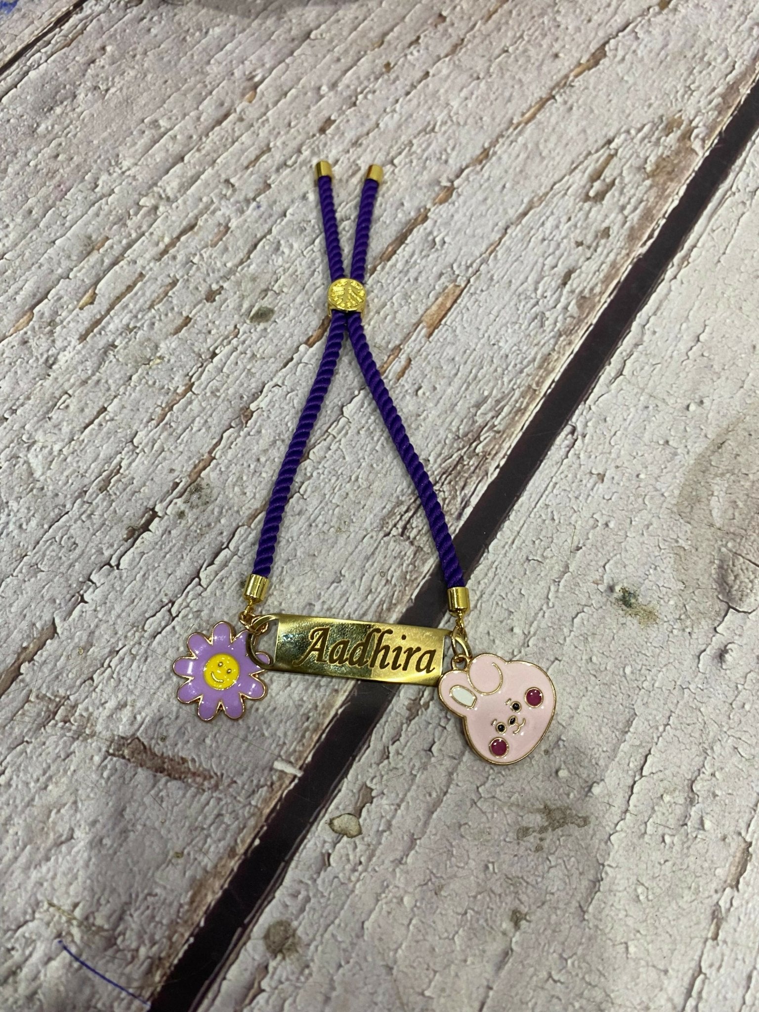 Personalized Bond Band Rakhi with charm featuring custom name personalization, decorative charm detail, comfortable band design, and a thoughtful keepsake for Raksha Bandhan celebrations.