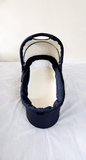 babycab Noah Carrycot Bassinet in Navy Blue, designed as a stroller attachment with a comfortable padded interior, protective canopy, sturdy construction, and cozy lie-flat space for newborns and young infants.