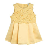 Yellow dress with floral embellishments on a white background