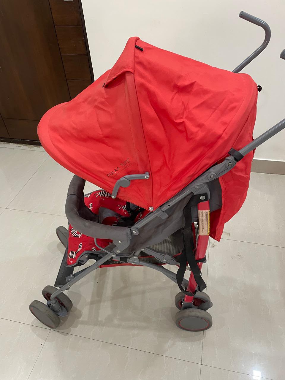 POLKA TOTS baby stroller with 5-point safety harness, adjustable canopy, storage basket, lightweight umbrella-fold design, and smooth wheels for babies and toddlers up to 20 kg (0–5 years).