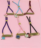 Personalized Bond Band Rakhi with charm featuring custom name personalization, decorative charm detail, comfortable band design, and a thoughtful keepsake for Raksha Bandhan celebrations.