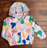 Colorful children's raincoat with cartoon patterns