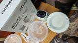 ROBOSON wearable breast pump with hands-free design, compact milk collection cups, adjustable suction settings, and portable pumping support for breastfeeding mothers.