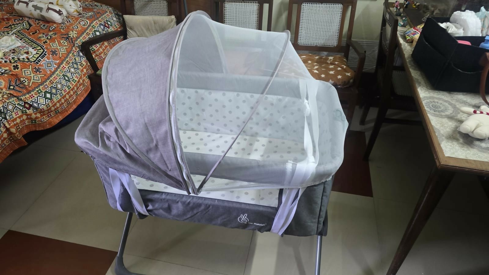 R for Rabbit Hop A Little baby cot bedside bassinet with sturdy frame, breathable sides, adjustable height, and a cozy sleeping space for newborns and infants.