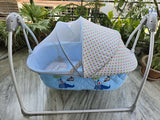 R for Rabbit Lullabies automatic baby cradle with gentle swing motion, comfortable sleeping space, sturdy frame, soothing design, and secure construction for newborns and infants.