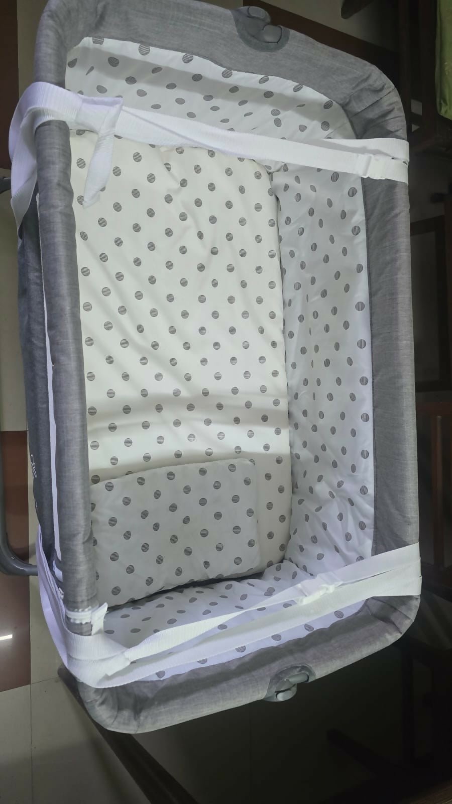 R for Rabbit Hop A Little baby cot bedside bassinet with saturdy frame, breathable sides, adjustable height, and a cozy sleeping space for newborns and infants.