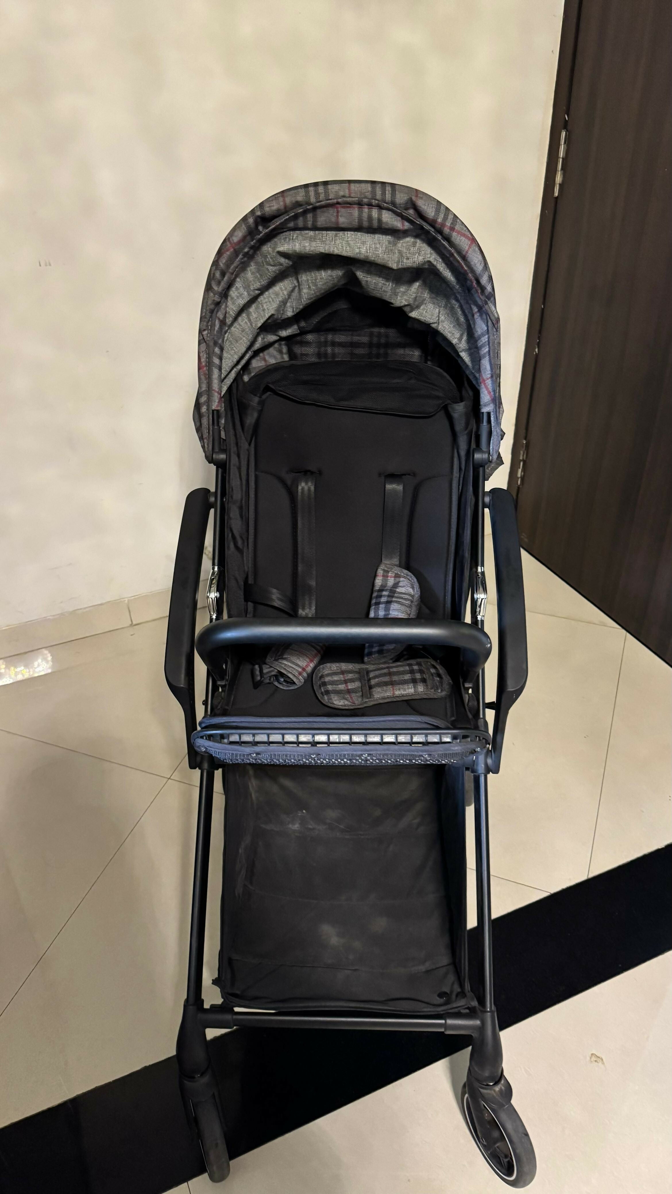 R FOR RABBIT Street Smart Nova Kids Stroller in Blue Black, Almost New condition, featuring comfortable seating, a travel-friendly design, protective canopy, safety harness, and smooth wheels for convenient everyday outings.