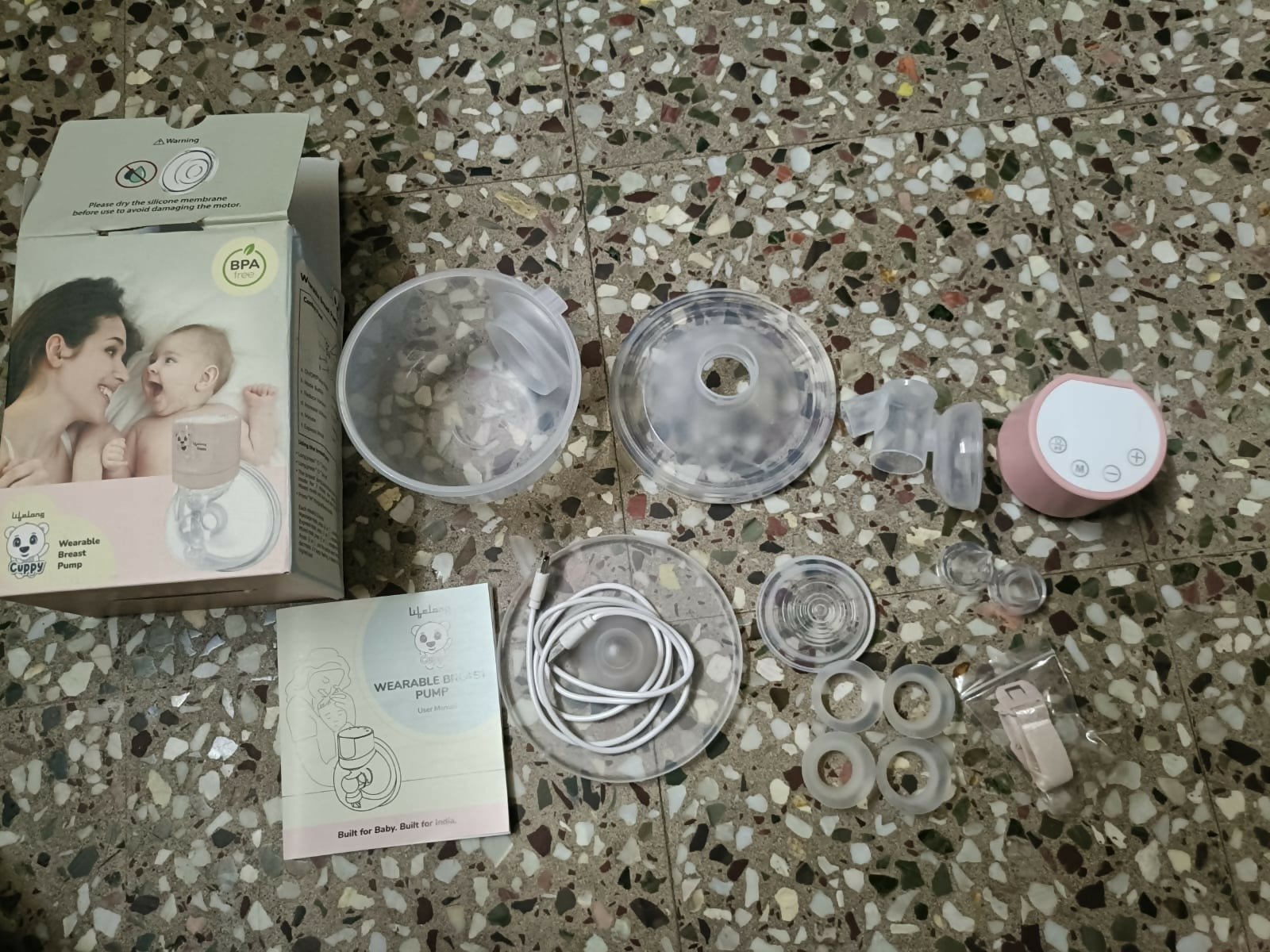 Lifelong Cuppy wearable breast pump with hands-free design, adjustable suction levels, lightweight collection cups, and rechargeable operation for comfortable and discreet milk expression.