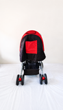 LuvLap Galaxy Baby Stroller Pram in Red & Black with reversible handle, reclining seat, adjustable canopy, safety harness, smooth wheels, foldable frame, and storage basket for comfortable baby travel.