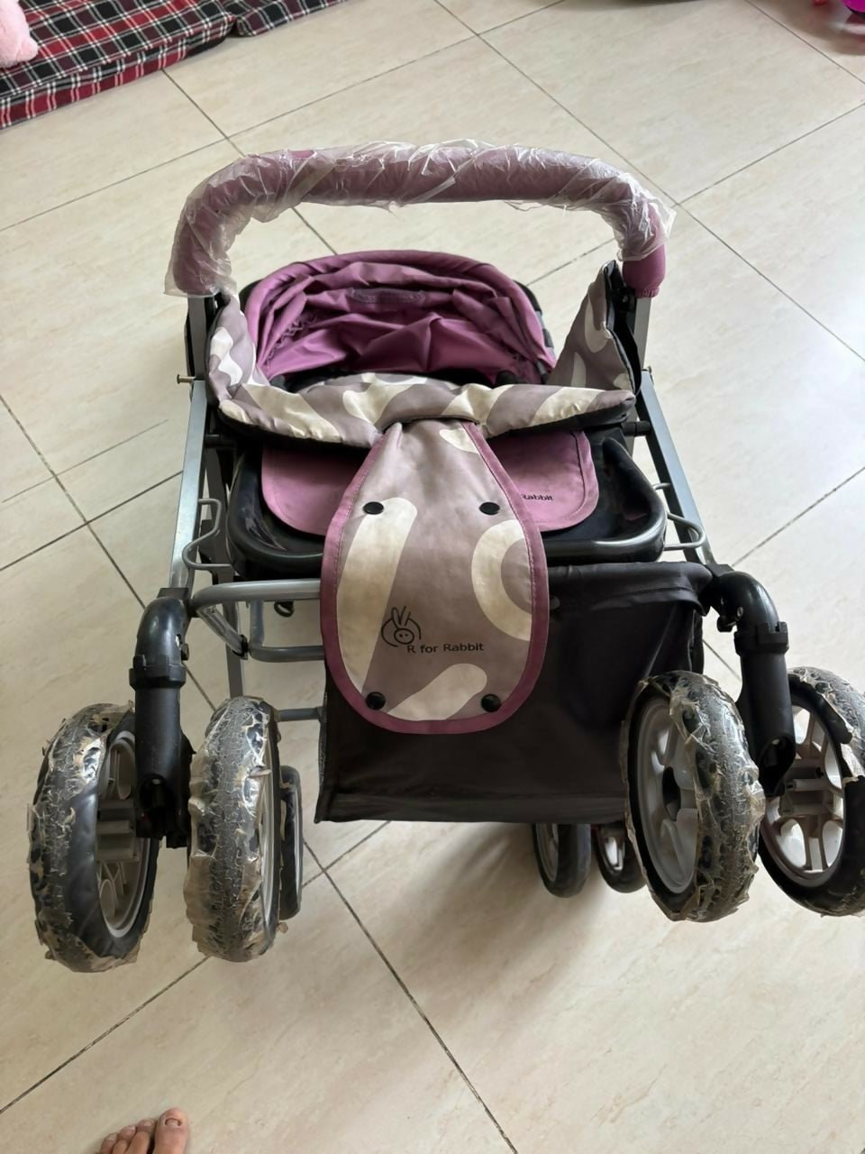 R for Rabbit Lollypop Lite baby stroller/pram with lightweight foldable design, reclining seat, adjustable canopy, 5-point safety harness, smooth wheels, and storage basket for comfortable everyday travel.