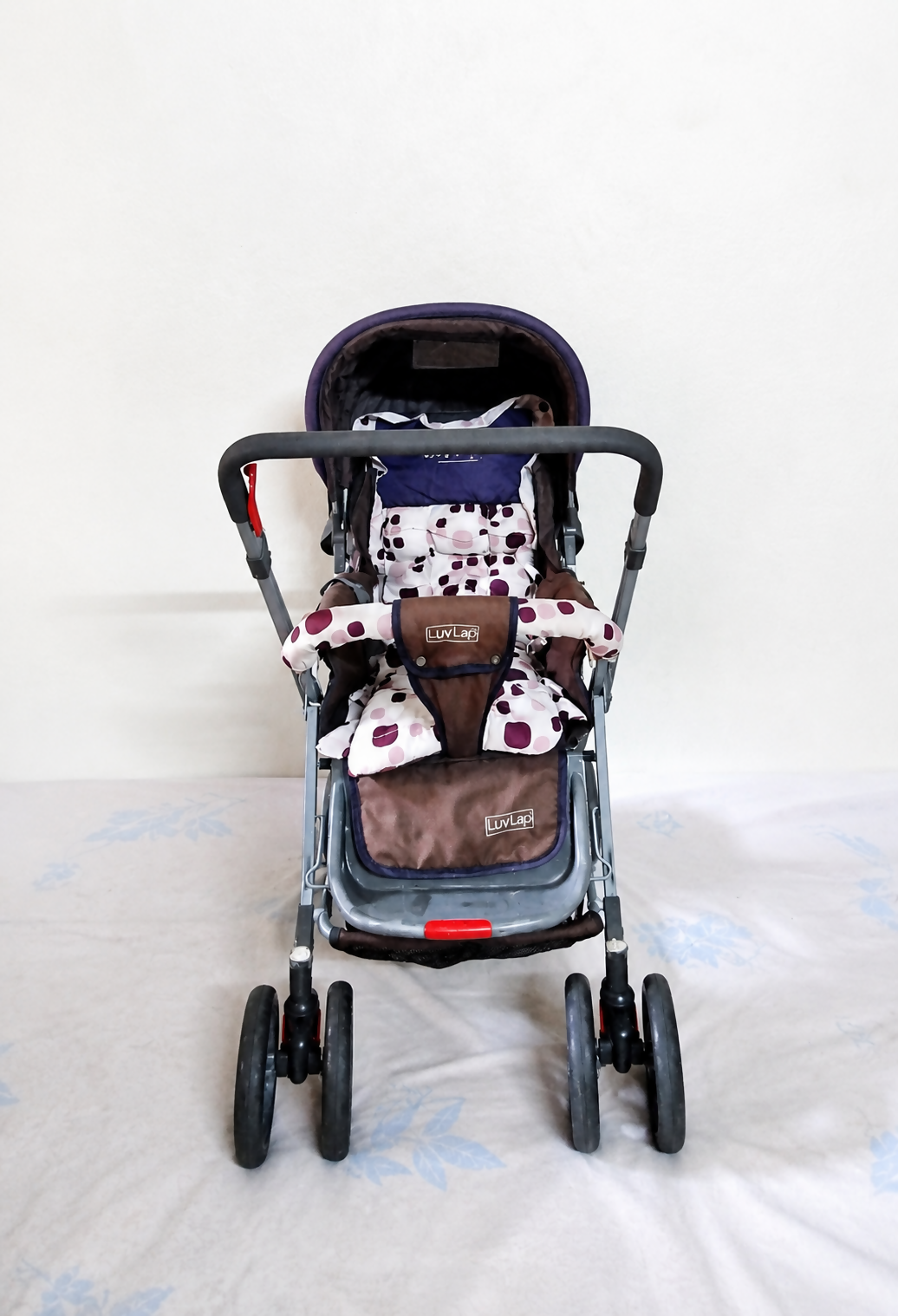 LUVLAP Sunshine reversible handle stroller with reclining seat, foldable baby pram design, safety harness, adjustable canopy, and comfortable travel support for babies and toddlers.