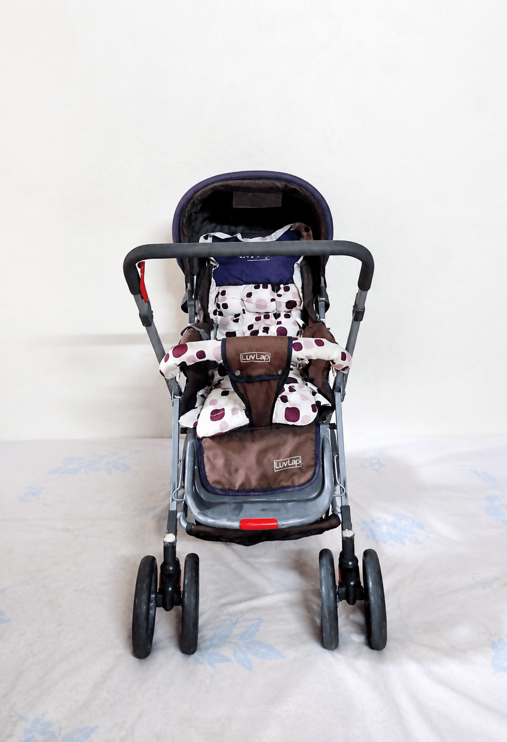 LUVLAP Sunshine reversible handle stroller with reclining seat, foldable baby pram design, safety harness, adjustable canopy, and comfortable travel support for babies and toddlers.