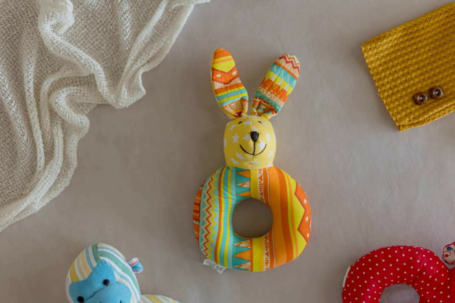 Introducing our Kangroo Faced Shape Rattle, a delightful and eco-conscious sensory toy crafted with care and consideration.