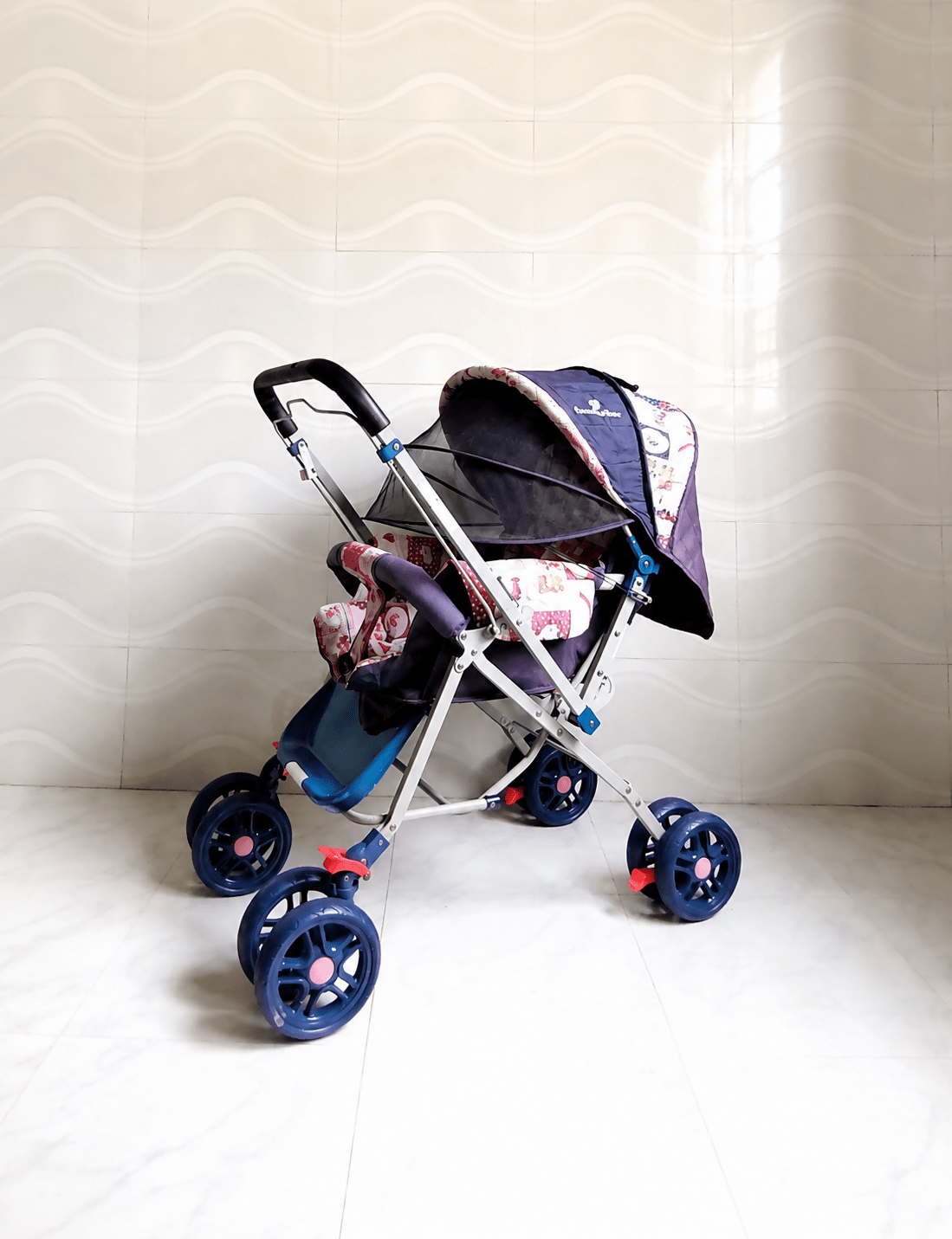 STAR & DAISY reversible baby stroller pram with mosquito net, reclining seat, reversible handle, safety harness, adjustable canopy, and comfortable travel support for babies.