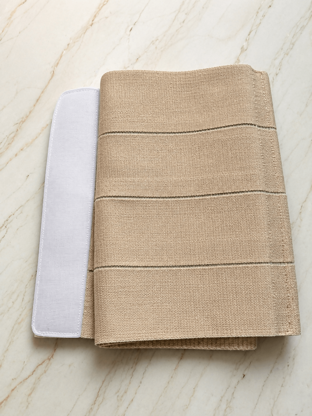 Sego abdominal binder post-pregnancy belt in beige with adjustable compression, supportive design, breathable fabric, and comfortable fit for postpartum abdominal support.