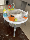 Skip Hop Play Gym with a soft padded play mat, hanging developmental toys, baby-safe mirror, and interactive activities to encourage tummy time, sensory exploration, and early development.