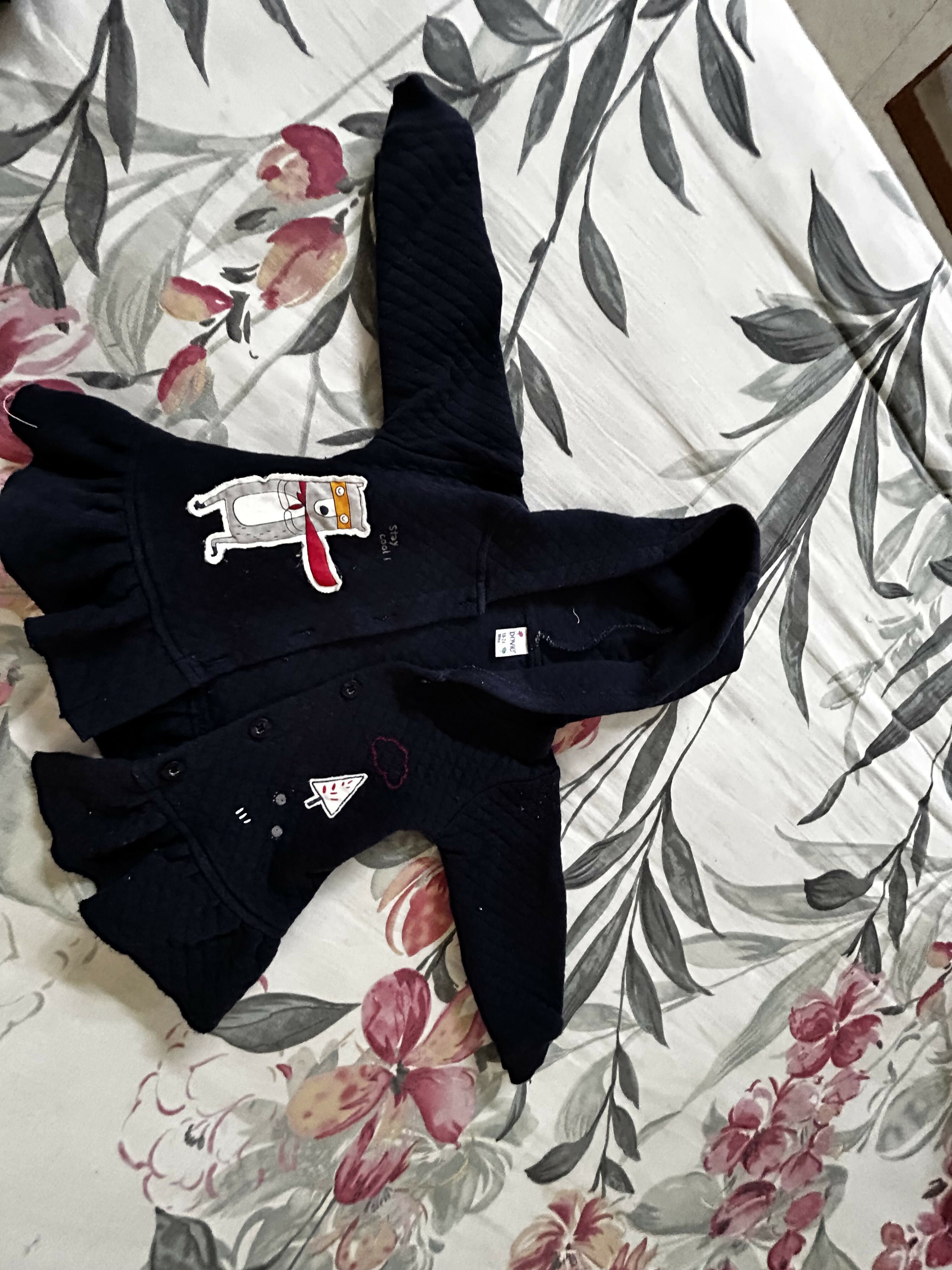 Blue baby sweater with soft knitted fabric, cozy warmth, comfortable fit, and classic design for everyday wear during cooler weather.