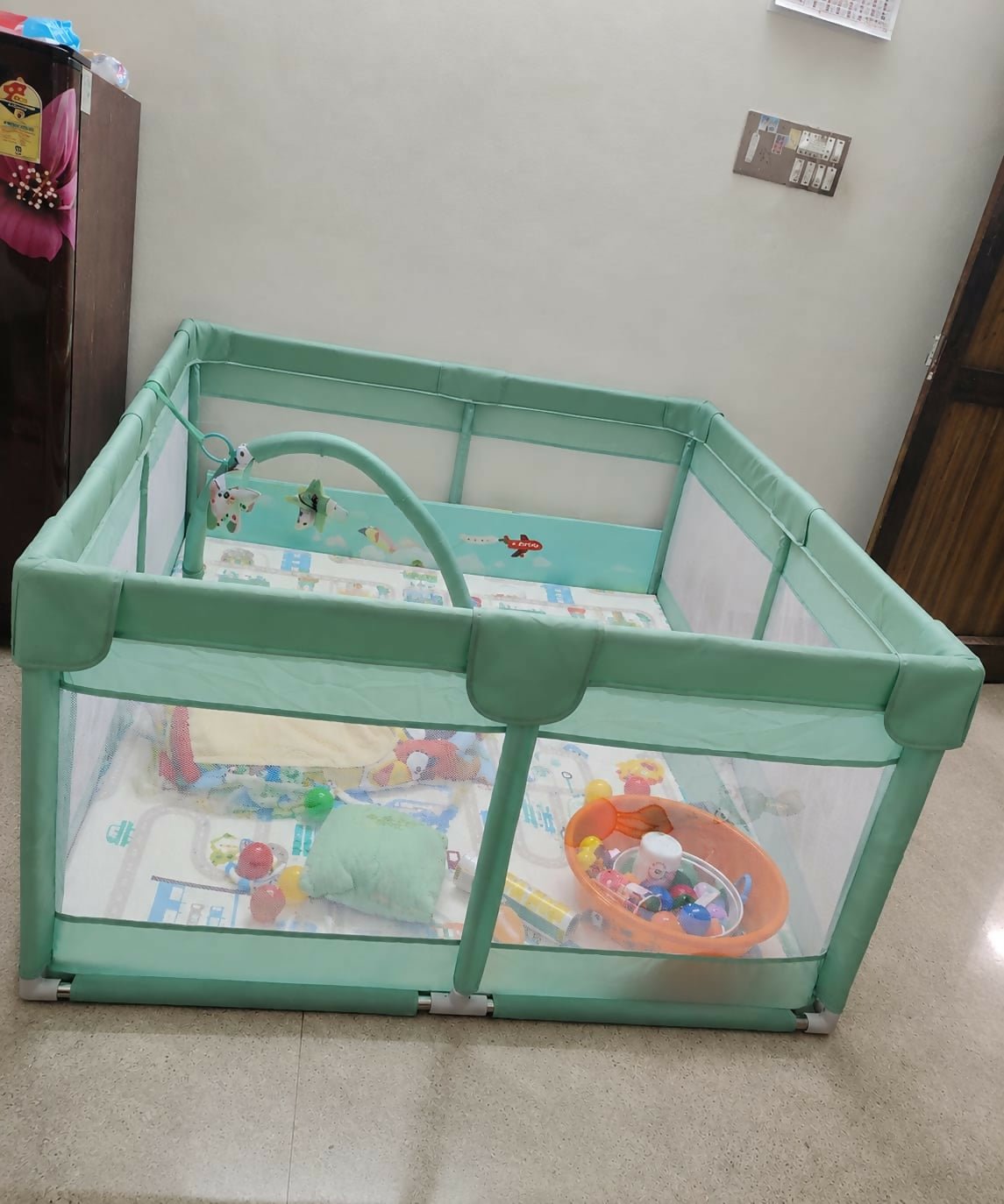 StarAndDaisy playpen with a spacious play area, sturdy frame, breathable mesh sides, secure safety lock, and a child-friendly design for safe indoor play.