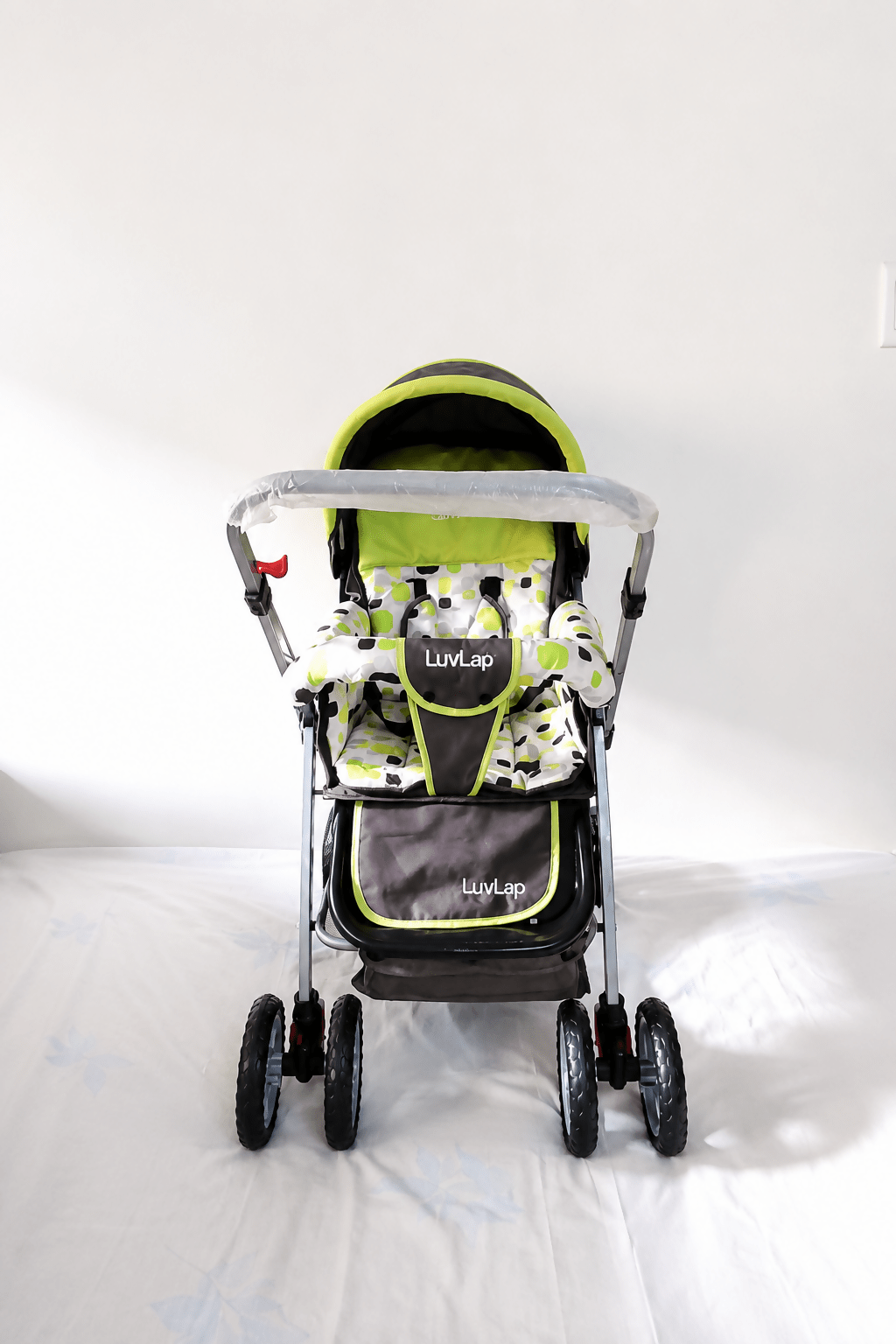 LuvLap reversible handle baby stroller with foldable travel pram design, reclining seat, adjustable canopy, 5-point safety harness, smooth wheels, and spacious storage basket for newborns and toddlers.