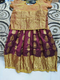 Traditional outfit with gold and maroon fabric