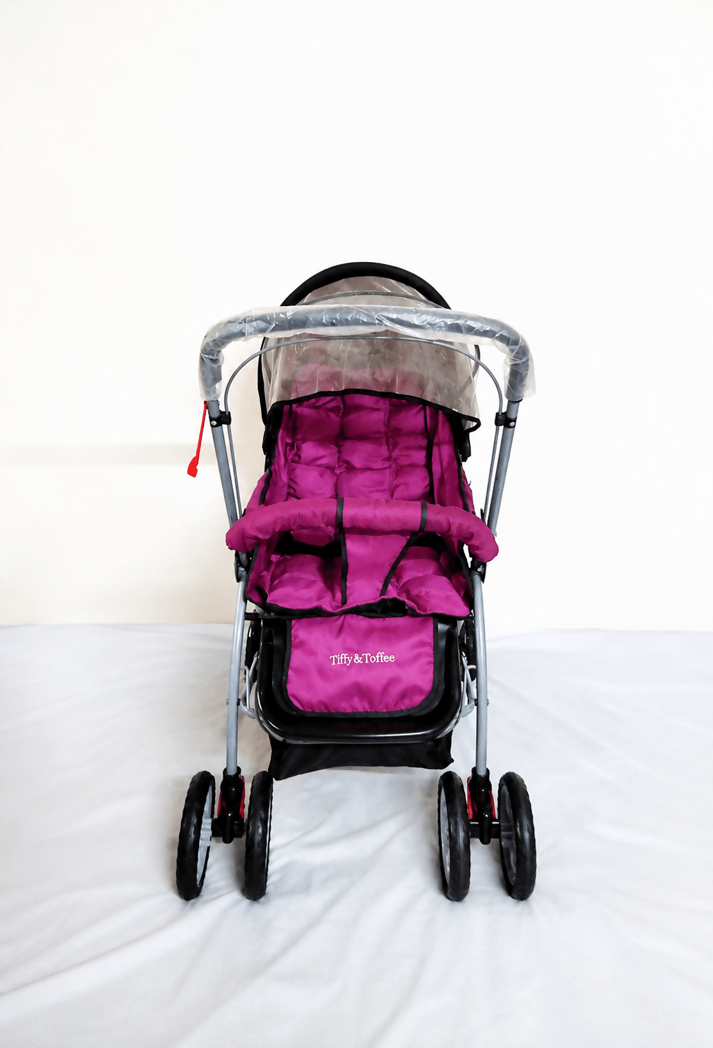 Tiffy & Toffee Maxtrem baby stroller with reversible handle, reclining seat, foldable travel pram design, adjustable canopy, 5-point safety harness, smooth wheels, and storage basket for babies and toddlers up to 22 kg.