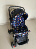 Babyhug Baby Stroller with a lightweight foldable frame, reclining seat, adjustable canopy, safety harness, smooth wheels, and storage basket for comfortable everyday outings with babies and toddlers.