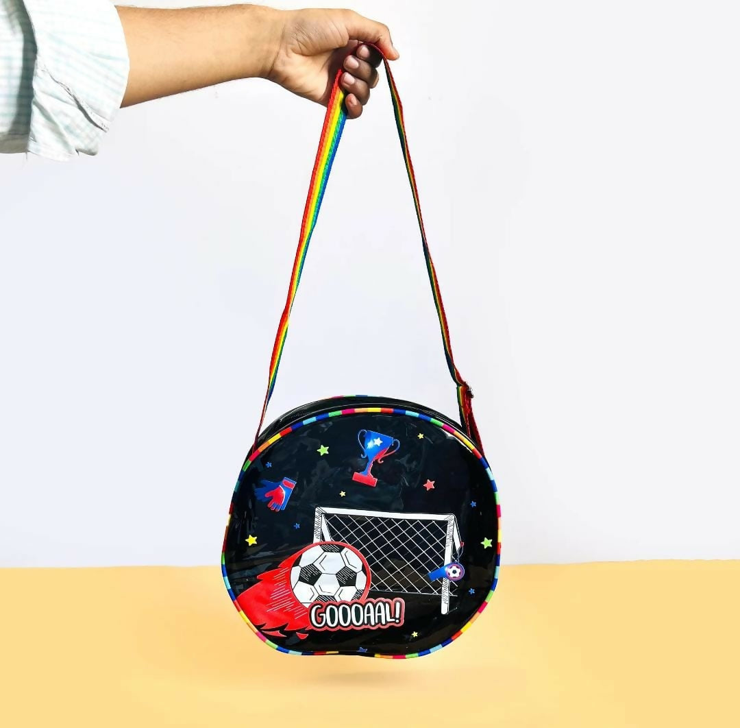 Round bag with sports-themed design held by a hand against a white background