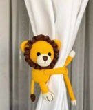 Adorable and functional curtain holders for baby rooms, designed to keep curtains neatly tied while adding a playful touch to nursery decor.