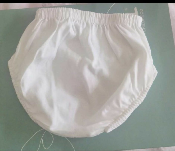 White diaper on a green surface
