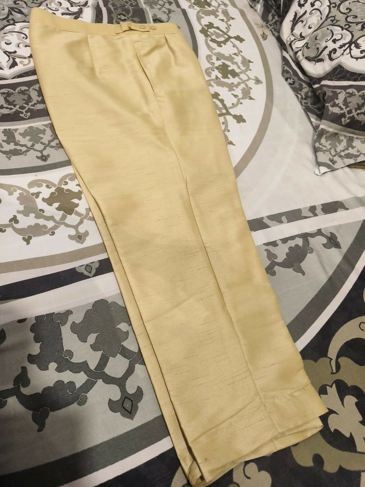 Beige pants on a patterned rug