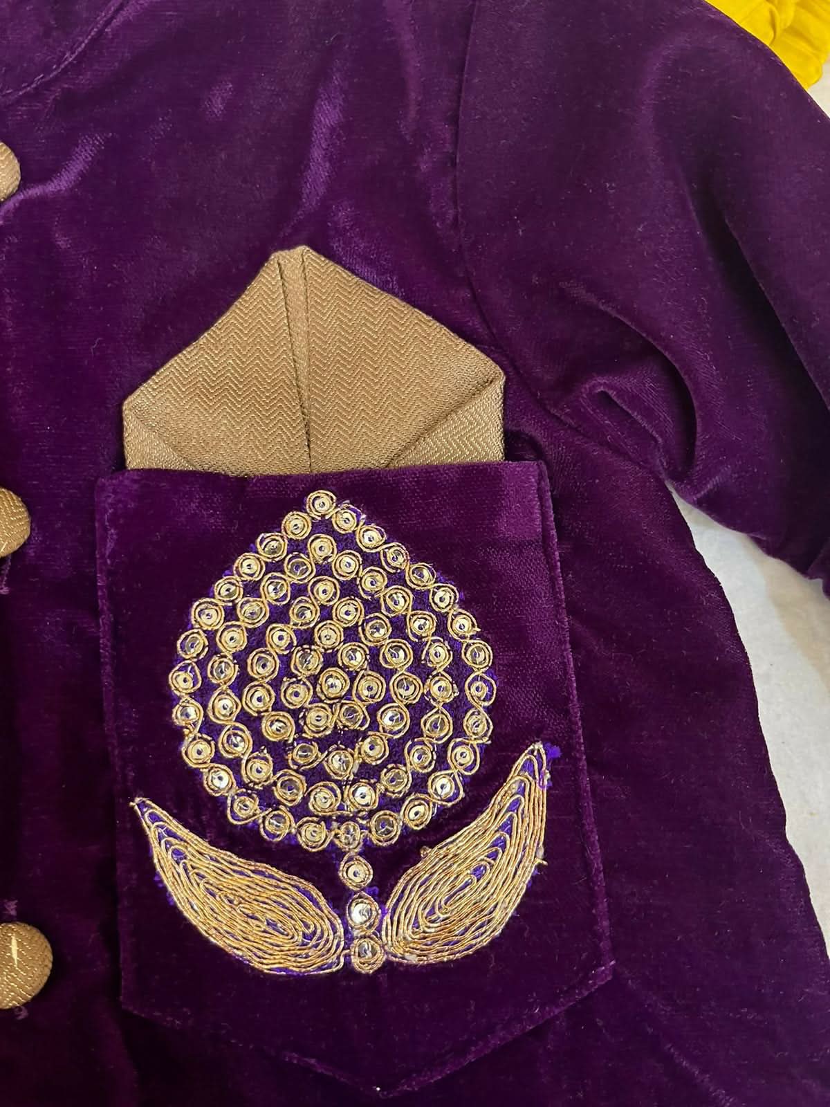 Elegant purple baby sherwani with intricate detailing, soft fabric, and comfortable fit, perfect for festive occasions and celebrations.