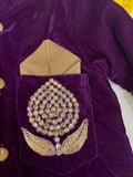 Elegant purple baby sherwani with intricate detailing, soft fabric, and comfortable fit, perfect for festive occasions and celebrations.