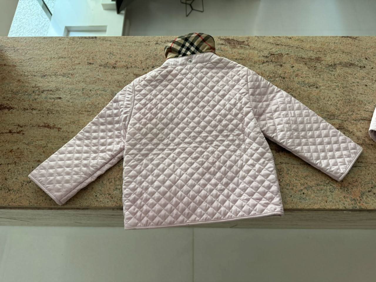 Dress your little fashionista in luxury with the Stylish Burberry Jacket with Detachable Hood - iconic style for every precious moment!