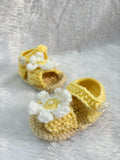 Crochet baby booties with flower