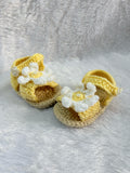 Crochet baby booties with flower