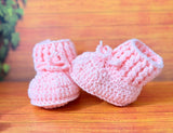 Crochet baby booties and bear set.