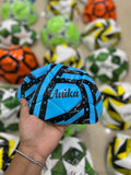 Customized size 5 football with child’s name printed, available in random colors with theme-based personalization options.