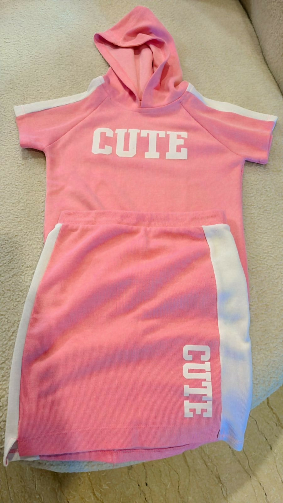 Shop now for the Pink T-shirt with Cap and Short Skirt set, offering comfort, style, and adorable charm for your baby’s everyday wear!