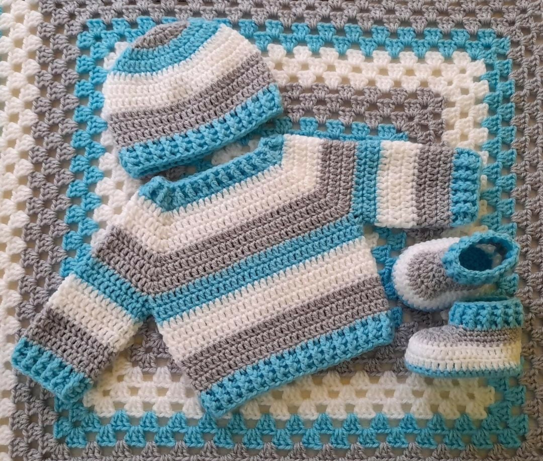 Sweater, Belt, Booties, and Blanket Set for Baby: Cozy and stylish winter ensemble, perfect for keeping your baby warm and fashionable.