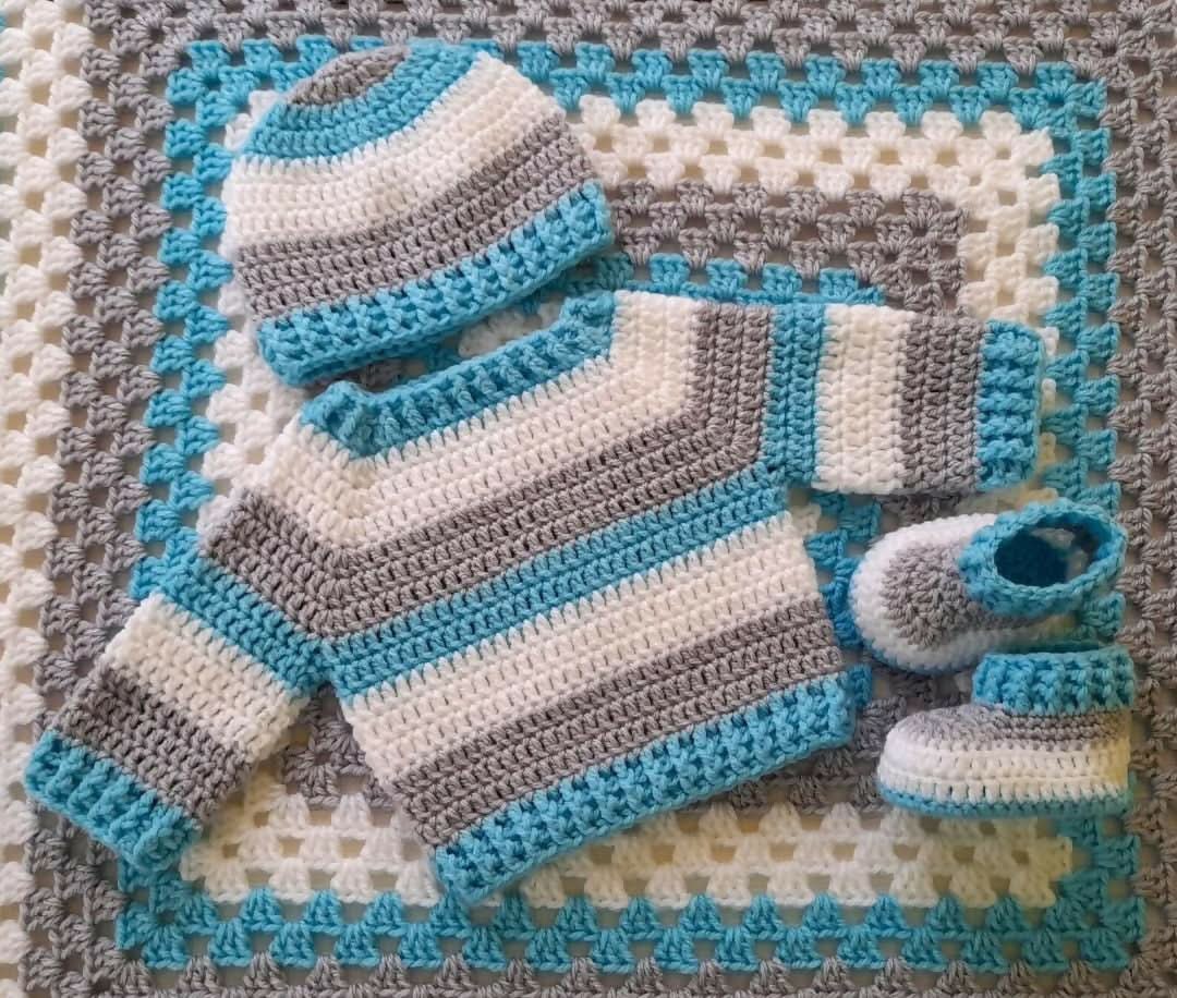 Sweater, Belt, Booties, and Blanket Set for Baby: Cozy and stylish winter ensemble, perfect for keeping your baby warm and fashionable.