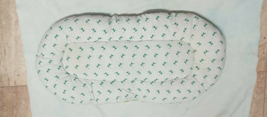 Soft and portable baby bed for newborns – perfect for home or travel.