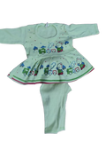 Children's outfit with a green top and pants featuring train designs on a white background